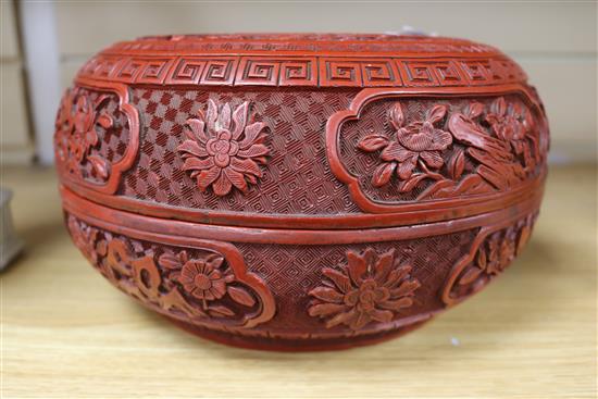 A 19th century Chinese cinnabar lacquer box and cover, diameter 10in.
